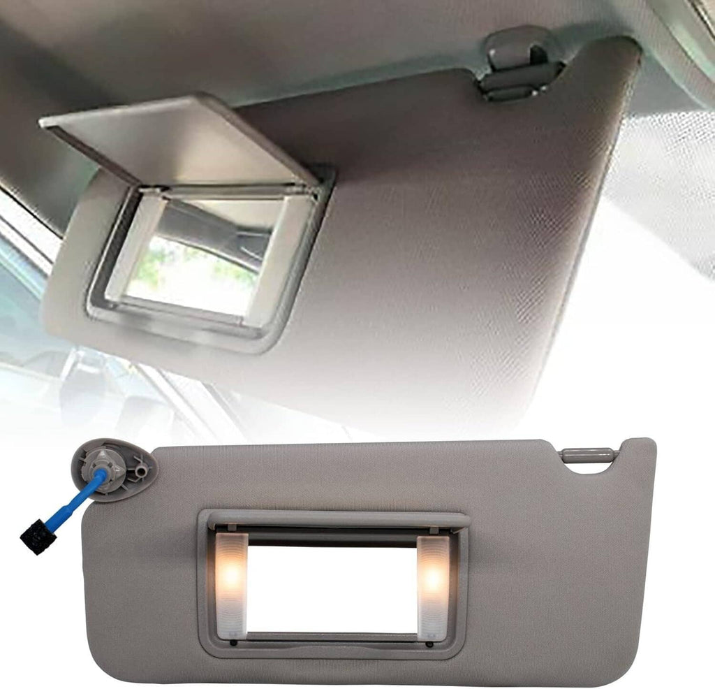 Gray sun visor with LED-lit mirror window and mounted module on the back