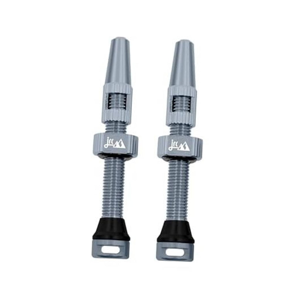 Gunmetal Presta tubeless valve stem pair with knurled metal body and black base.