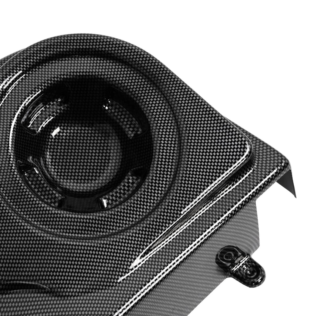 Carbon-fiber style speaker grille detail with textured black pattern and silver trim
