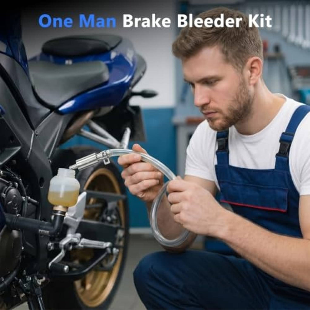 One-way brake bleeder hose kit near motorcycle wheel; clear tube and valve assembly.