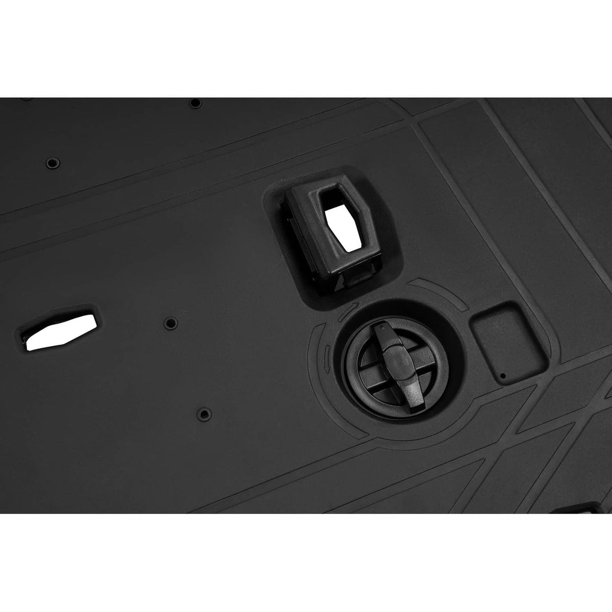 Textured black cargo rack panel with circular recess and rectangular mounting slot