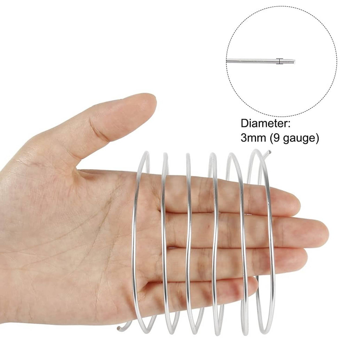 Silver aluminum craft wire held by hand, 3mm diameter (9 gauge) shown