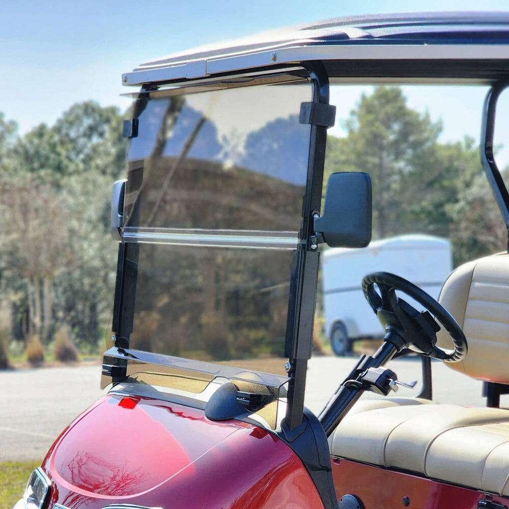 Installed tinted golf cart windshield screen with black frame and clear view