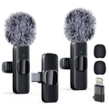 Black wireless lavalier lapel microphone set with two furry windshields and clip mounts