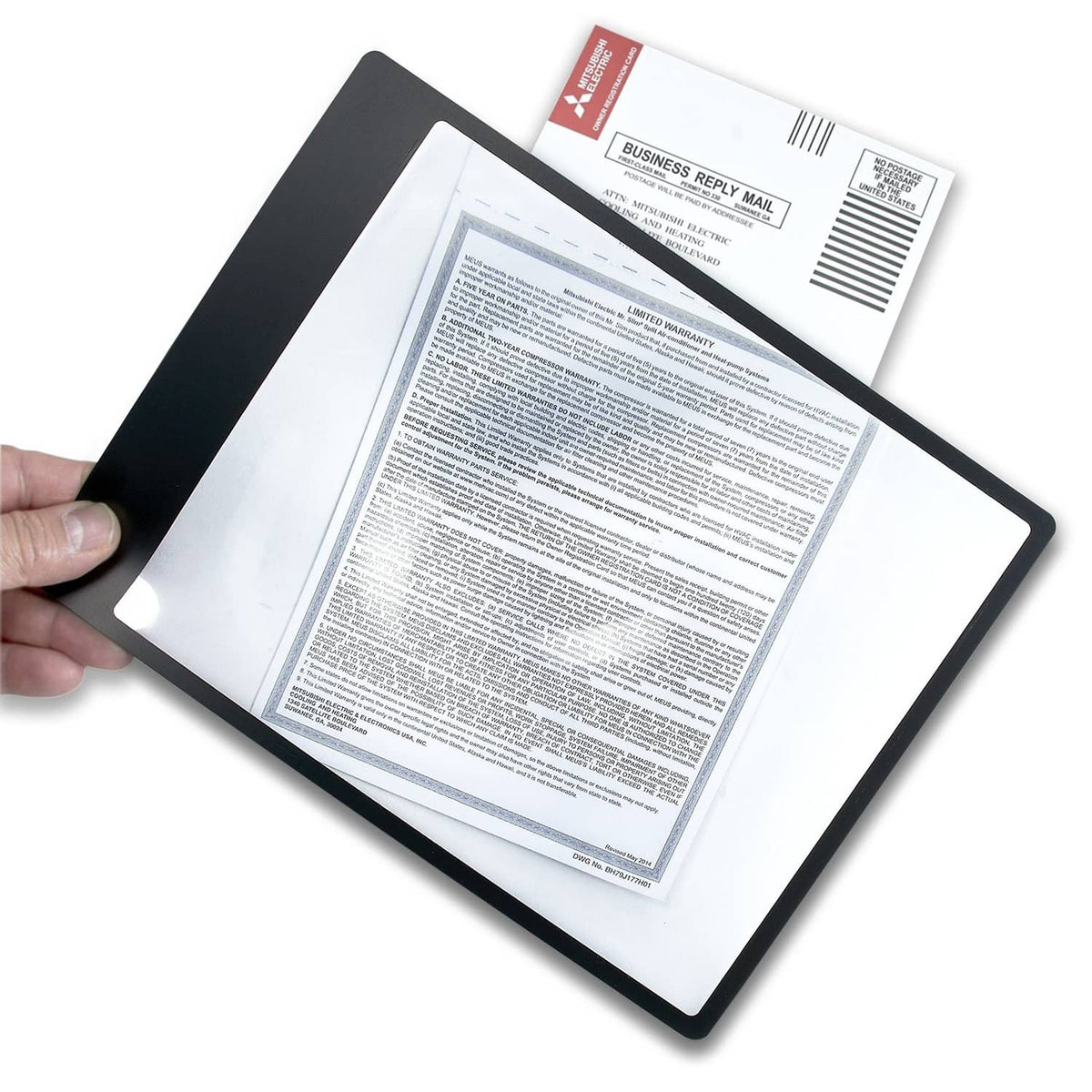 Carson page magnifier held over printed letter sheet, black flexible frame