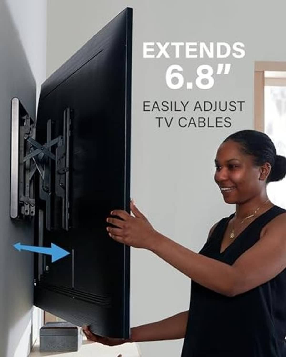 Black TV wall mount on wall with slim bracket for clearance around the TV
