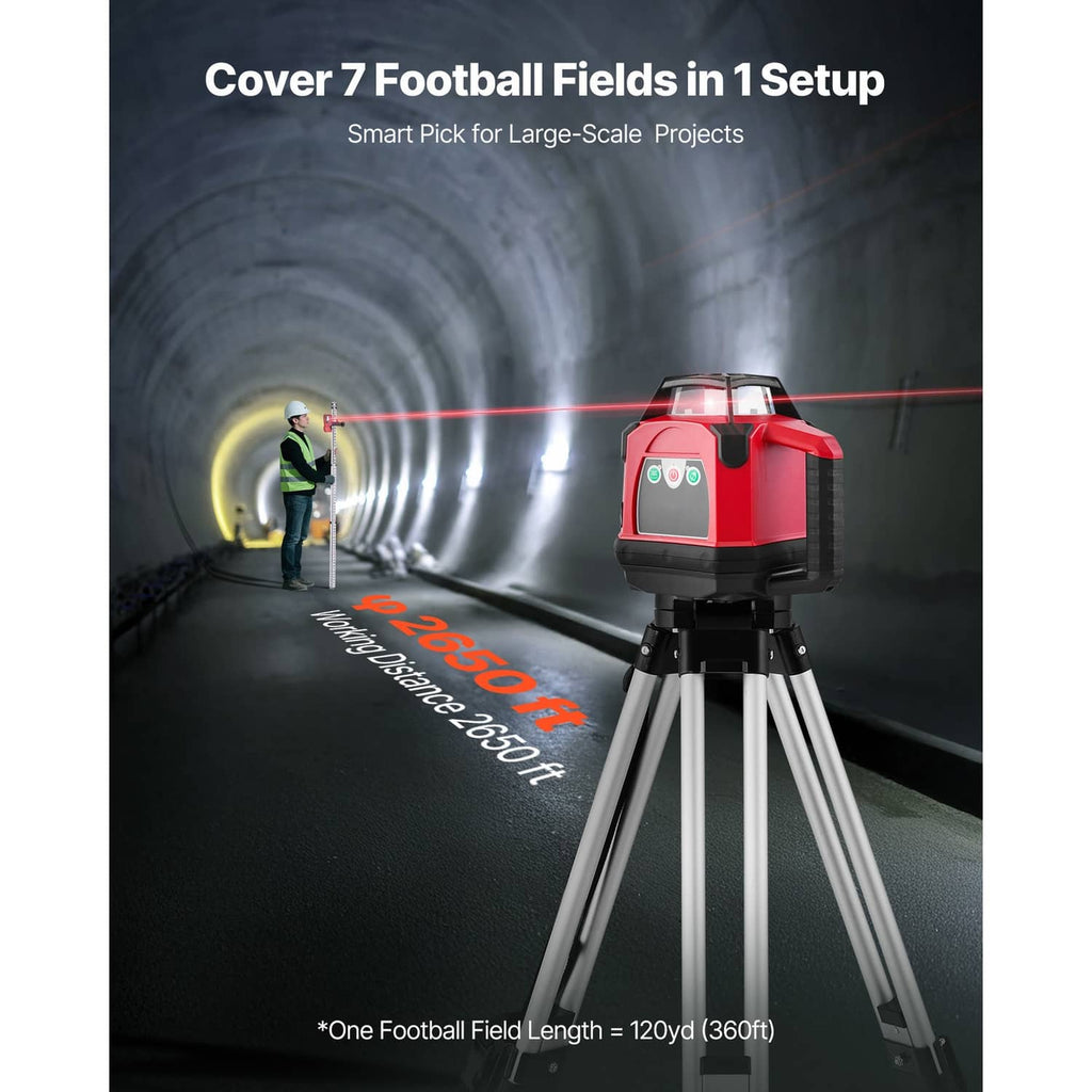 Red rotary laser level on tripod projecting red horizontal laser line in dark tunnel