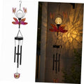 Solar metal wind chime with pink butterfly accents, flower spinner, and glass lantern