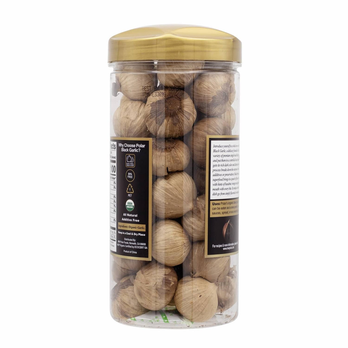 Organic black garlic whole bulbs in clear plastic jar with gold lid, side view