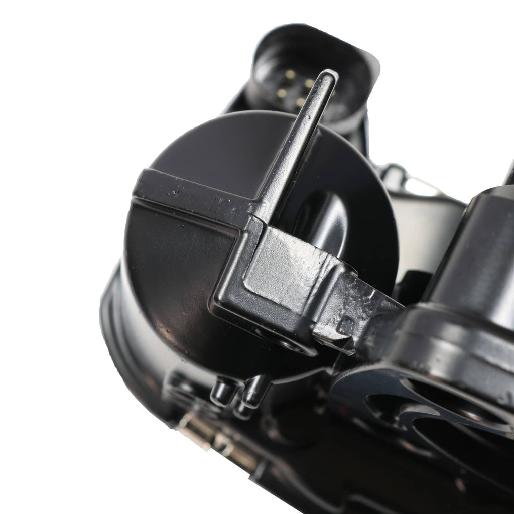 Throttle body close-up of black intake cap and metal bracket detail