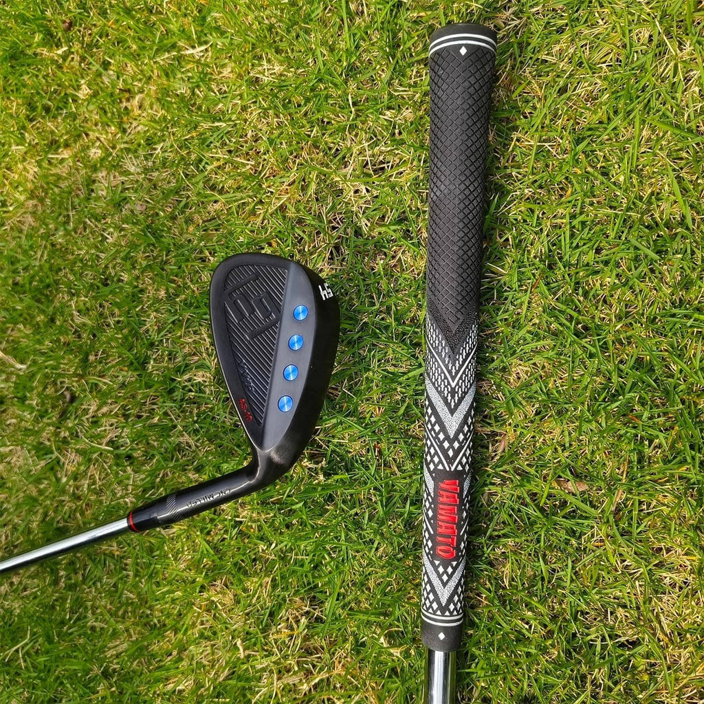 Black golf wedge with patterned grip, standing on grass beside the club head