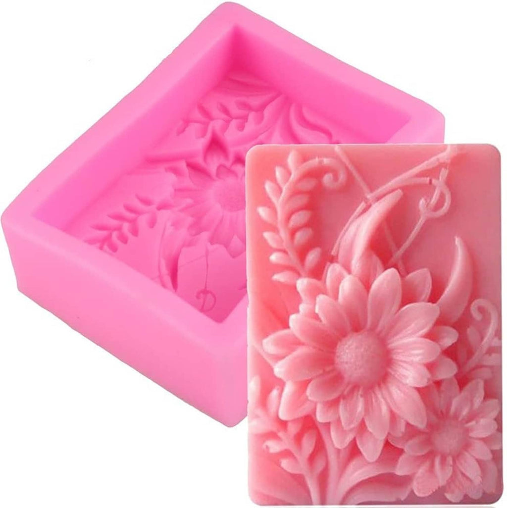 Pink rectangle silicone soap mold with embossed flower and leaf pattern cavities