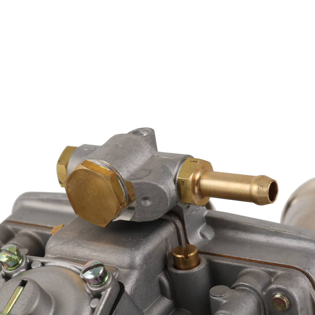 Carburetor side fitting close-up with brass adapter and cast aluminum housing