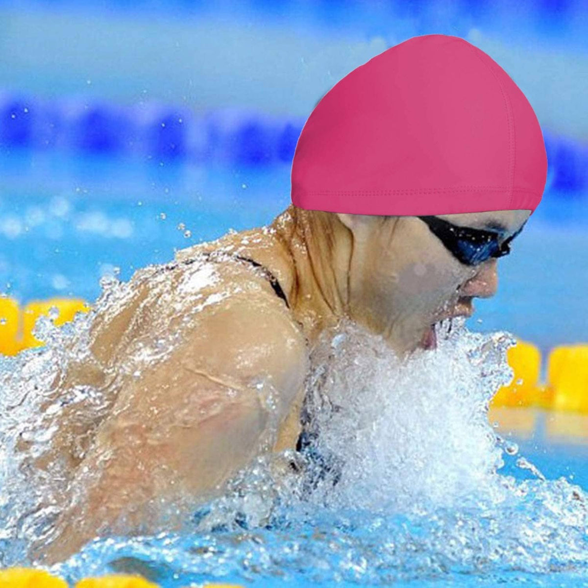 Pink swim cap on swimmer in the water with elastic rim visible