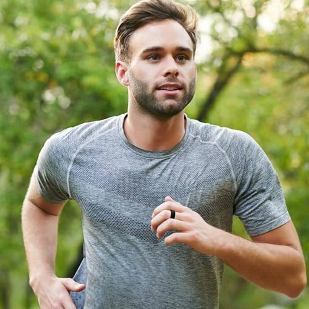 Oura Ring protector not clearly visible; man jogging outdoors
