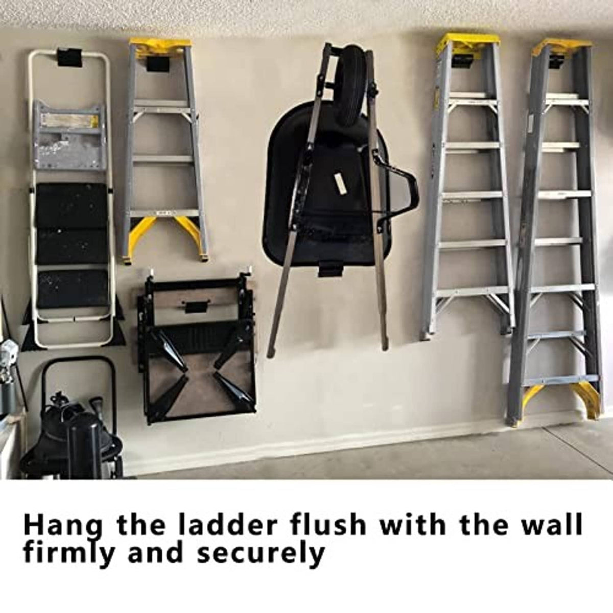 Wall-mounted ladder hooks in a garage, holding a ladder flush and secure