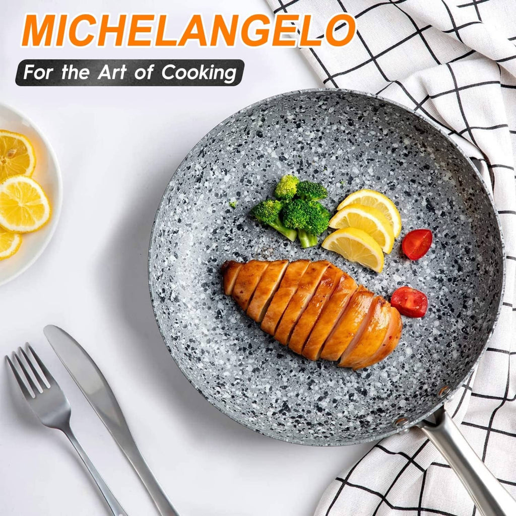 8-in gray granite nonstick skillet with handle, cooked sausage and lemon slices.