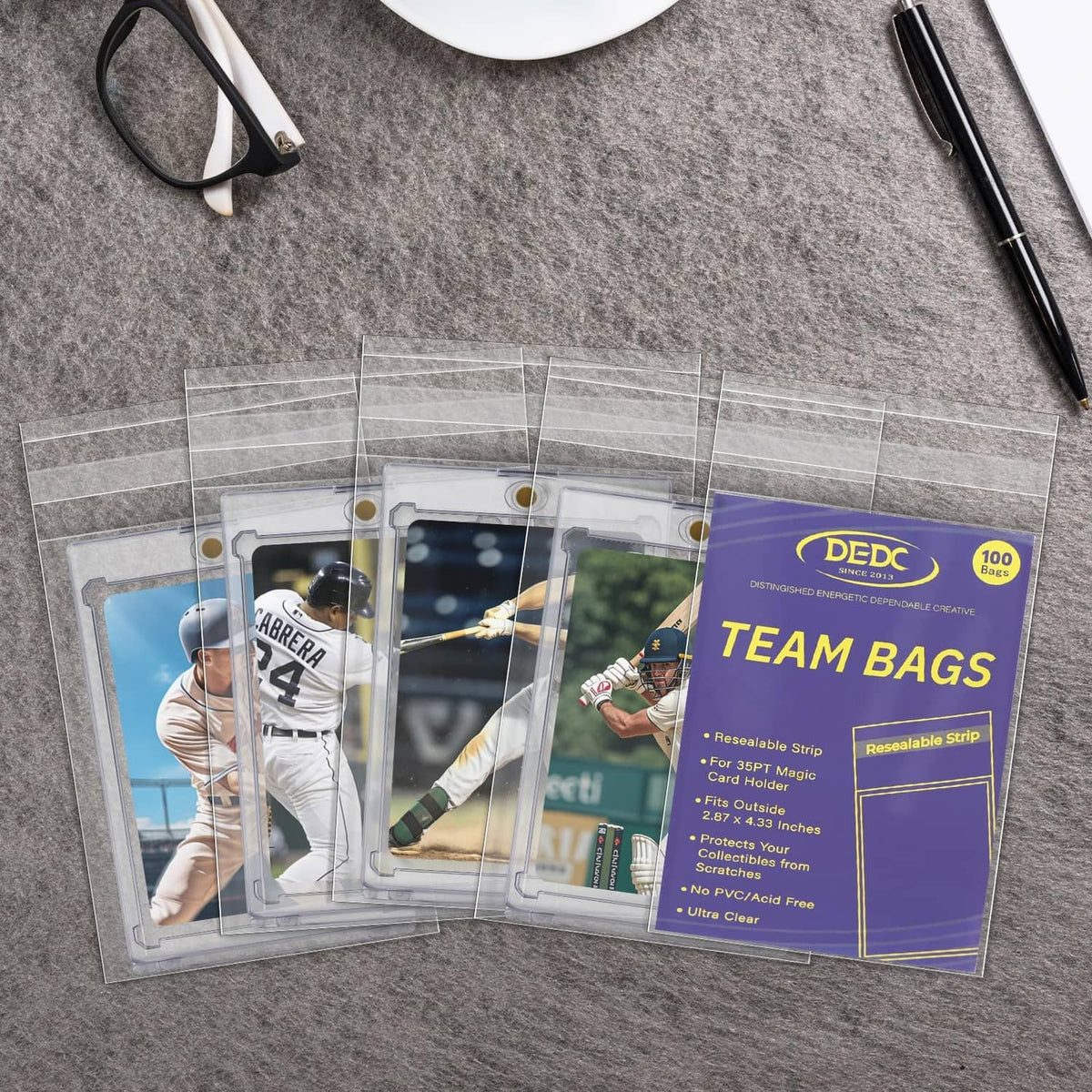 Set of transparent trading card team bag sleeves with clear fronts and sports cards inside