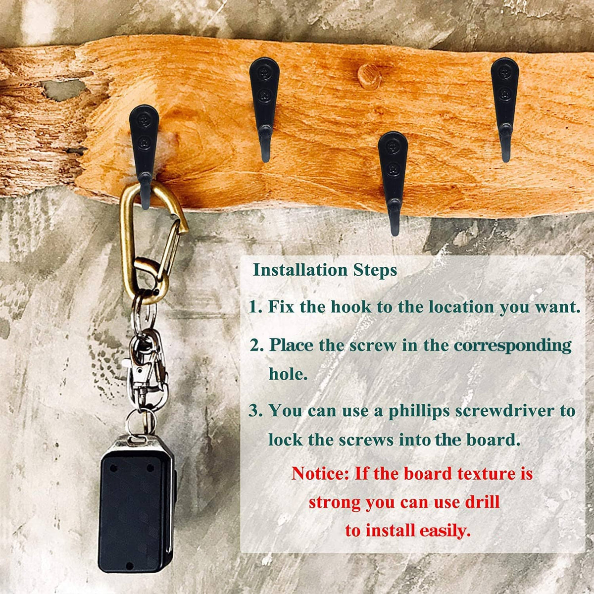 Black coat hook with chain attachment mounted on wooden board with two screws