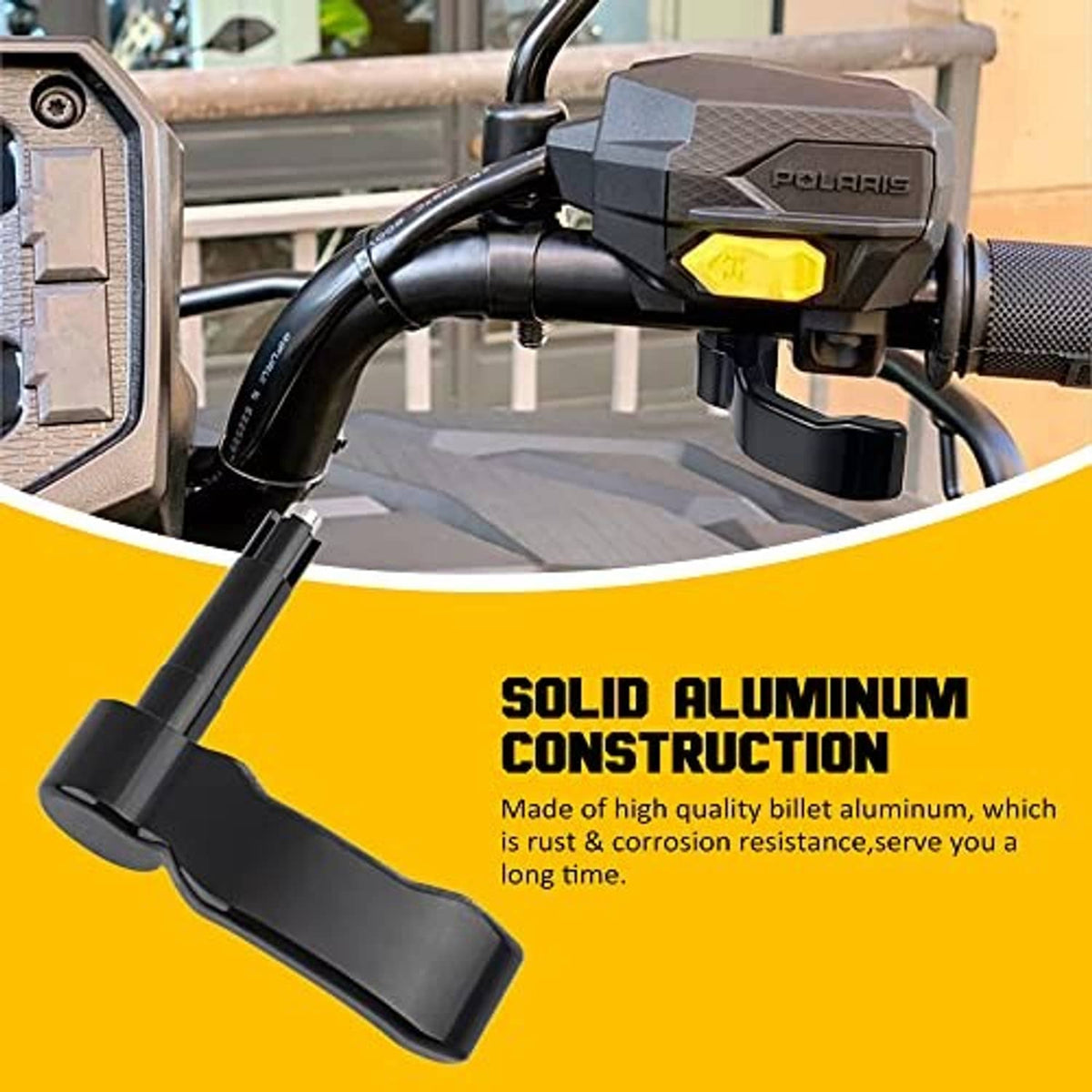 Black thumb throttle lever attached to ATV control housing with yellow plate