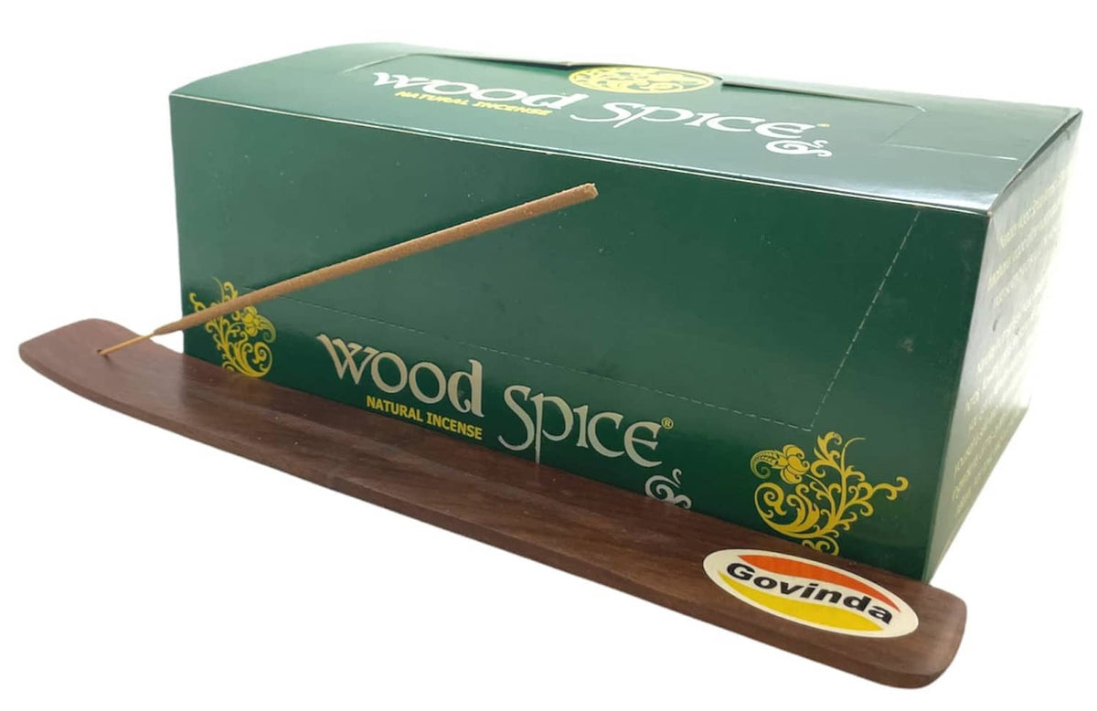 Incense kit with green box, wood holder, and incense stick on tray