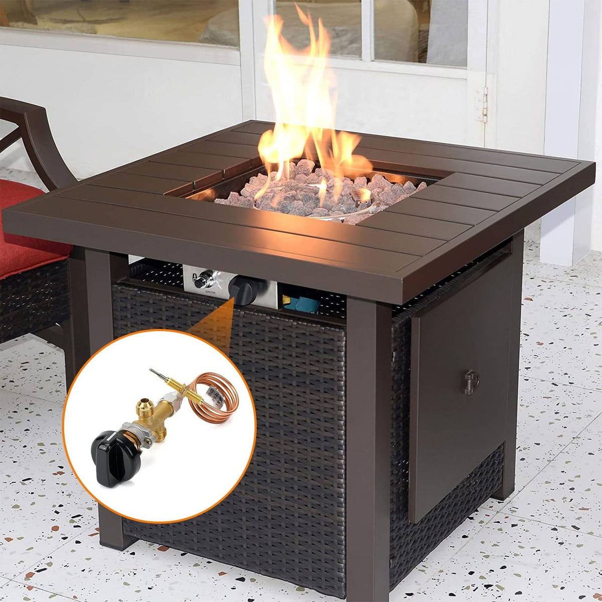 Gas fire pit burner with black control knob and connected copper thermocouple lead