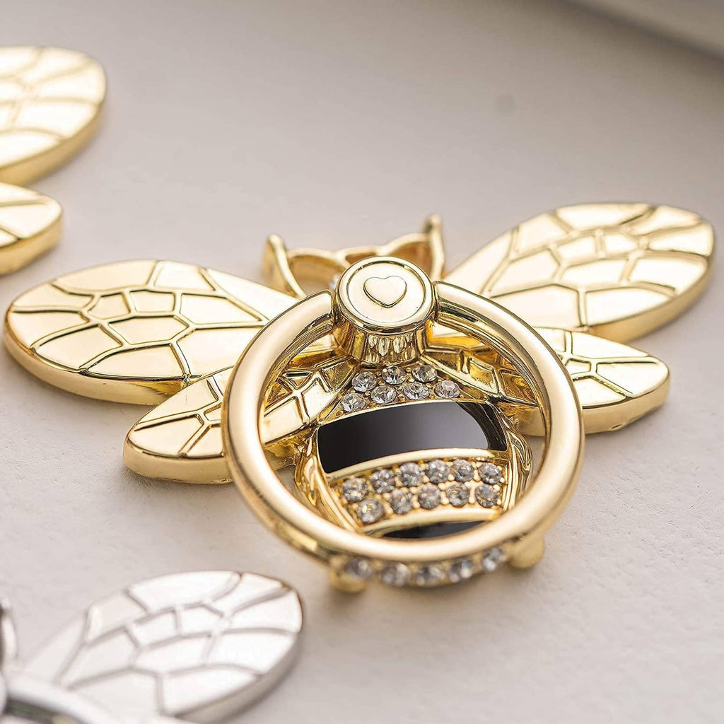 Gold bee phone ring holder with crystal inlay and heart badge on ring