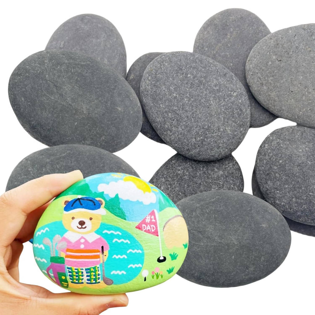 Gray oval river rocks with one painted rock showing a colorful landscape and animal