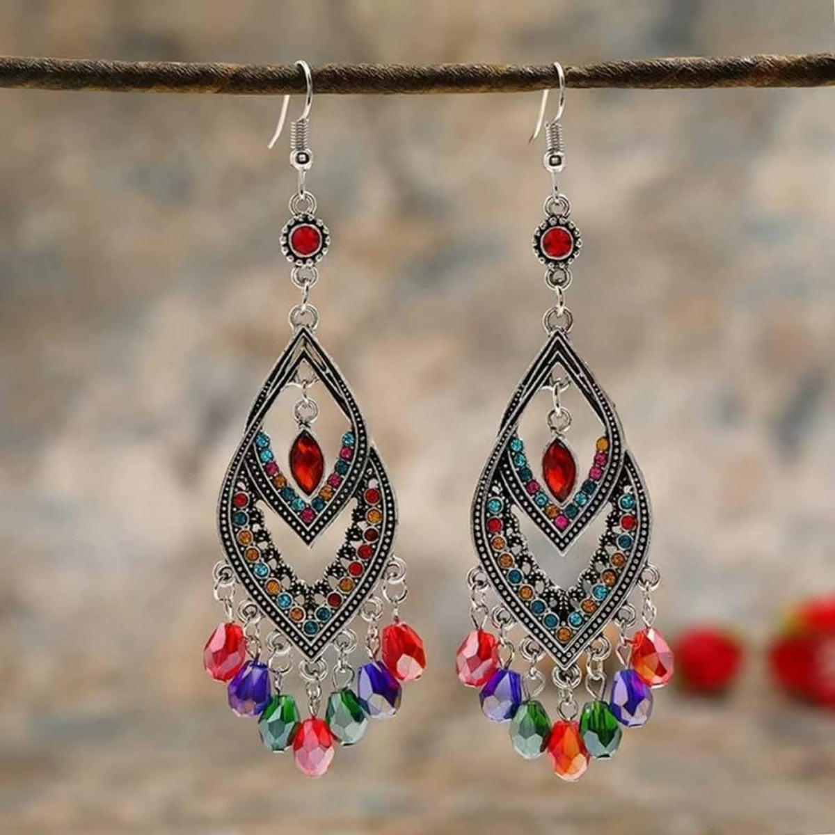 Pair of dangling earrings with red and multicolor faceted glass teardrop beads