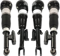 Set of four black air suspension struts with metal mounts and rod end bushings.