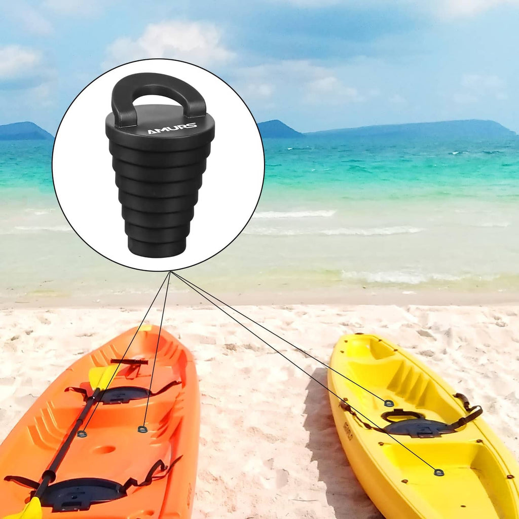 Black kayak scupper plug with handle, shown near a yellow kayak