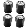 Set of black metal tire valve stem caps with Mercedes star and BENZ emblem