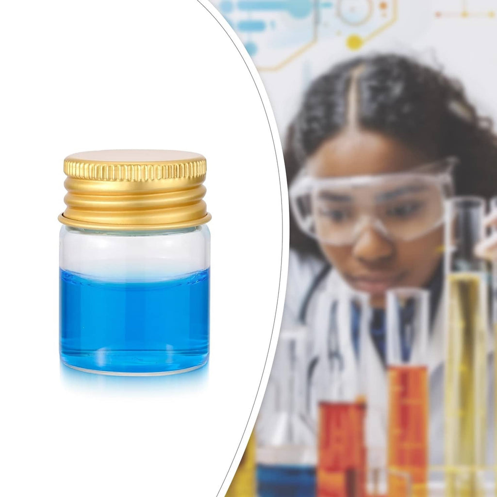 Close-up of a small clear glass vial with gold cap, filled with blue liquid