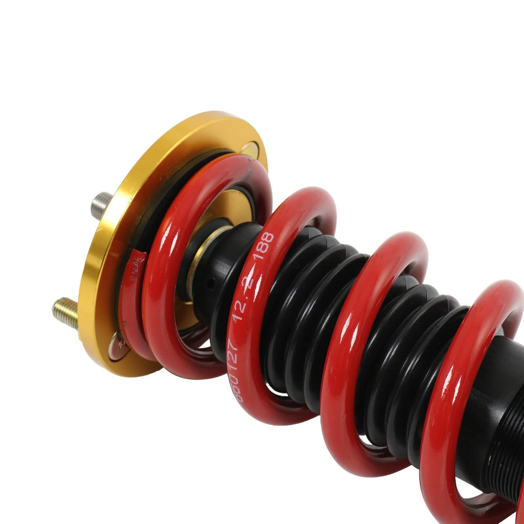 Coilover suspension assembly with red springs and black threaded shaft, gold top mount