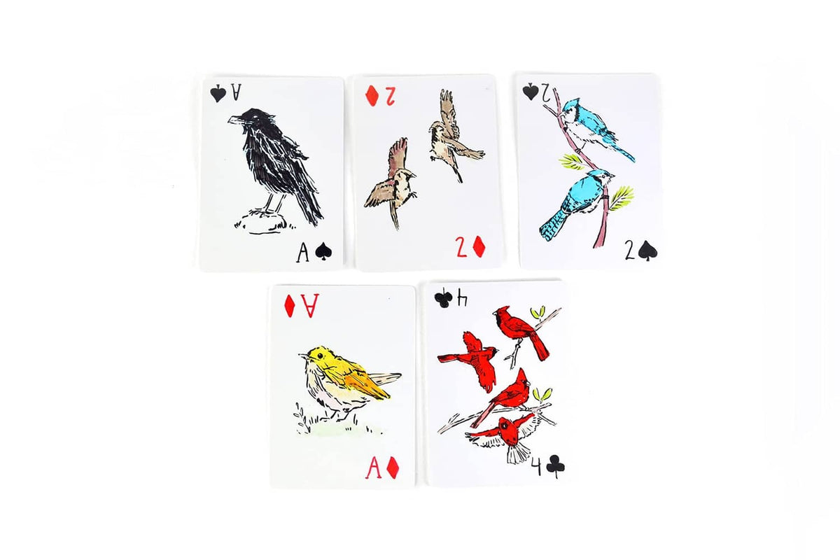 Six playing cards with colorful animal illustrations and suit symbols