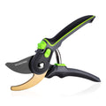 Bypass pruning shears with black and green handles and brass-colored lower blade