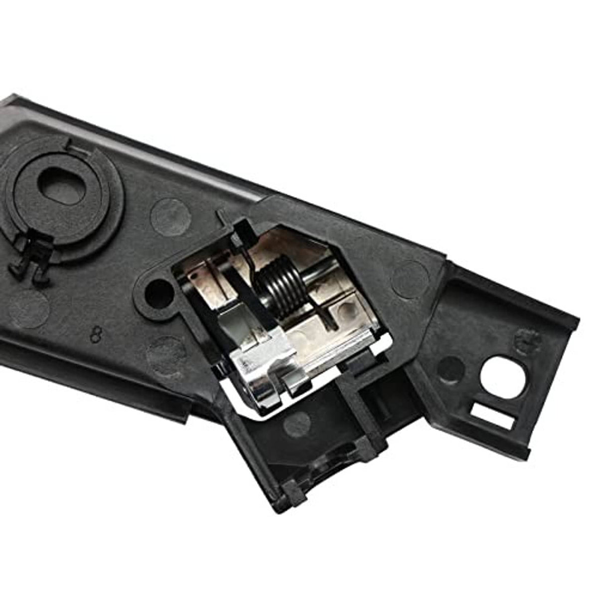 Interior door handle assembly with chrome lever and exposed spring latch on black housing