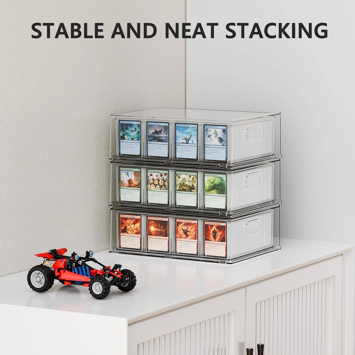 Stacked clear trading card storage boxes with side handles on a shelf
