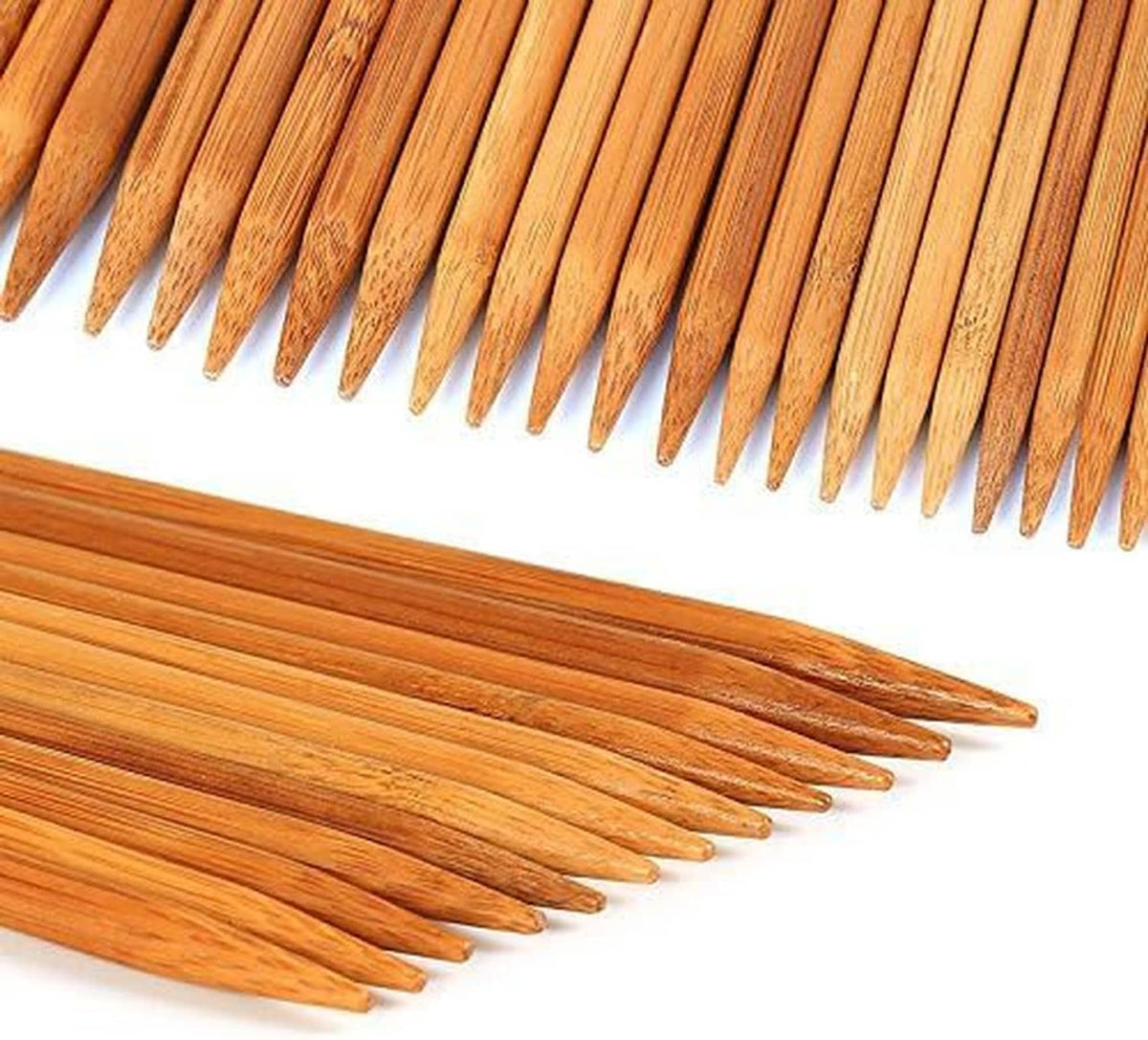 Row of bamboo double-pointed knitting needles with sharpened points, orange-brown