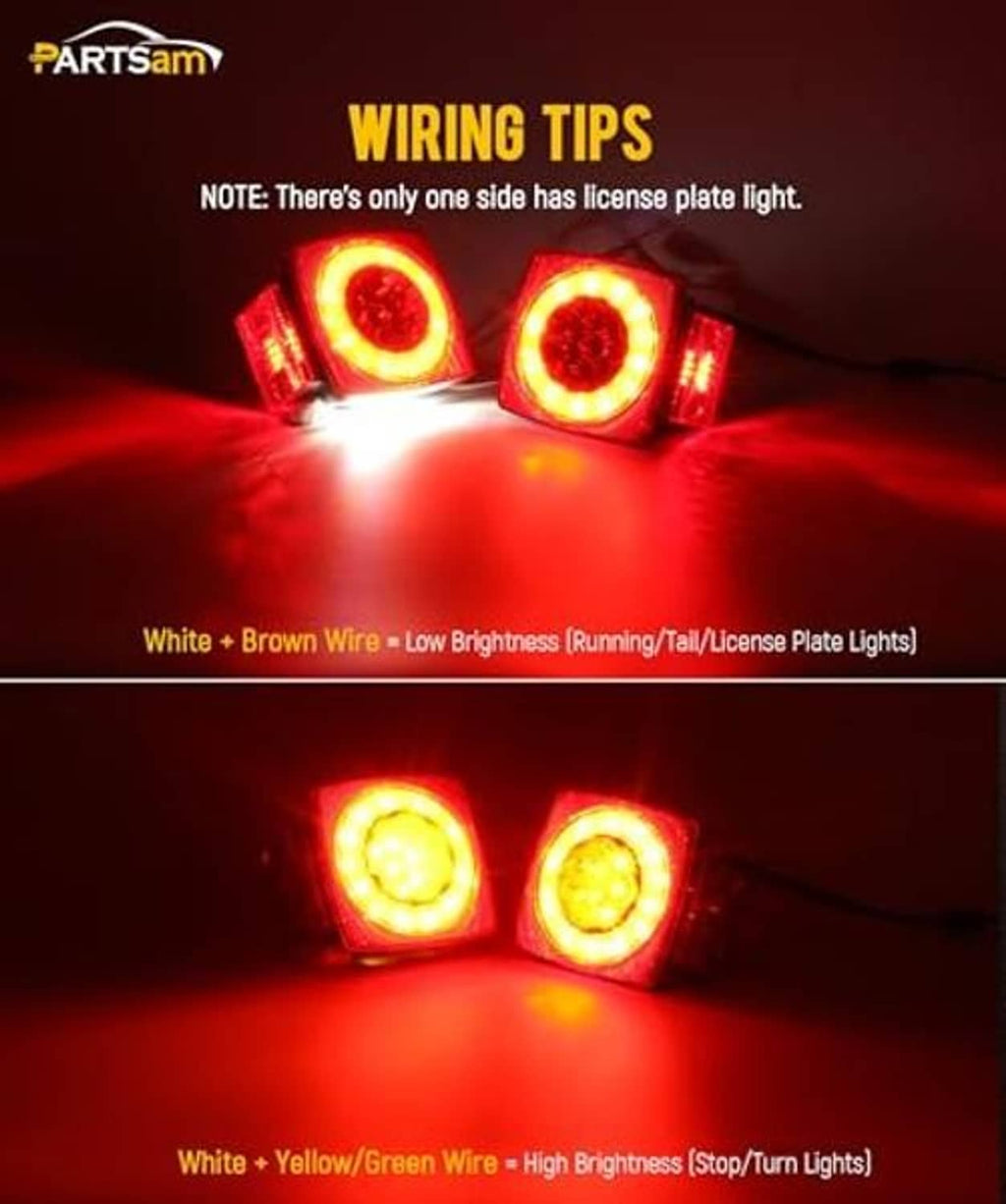 LED trailer tail lights with illuminated rings and visible colored wiring harness