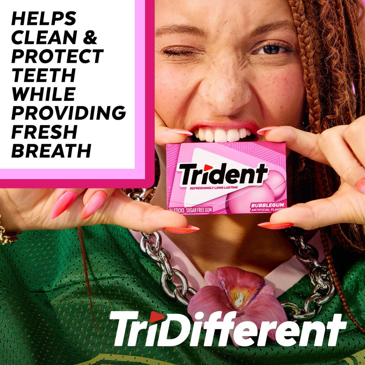 Trident Bubblegum sugar-free gum pack held near smiling mouth
