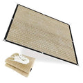Beige shade cloth panel with black border and rolled tie straps