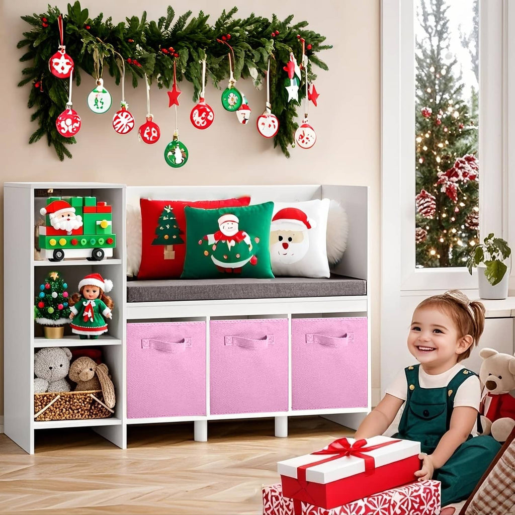Pink foldable storage cube bins with front handles in a kids storage bench