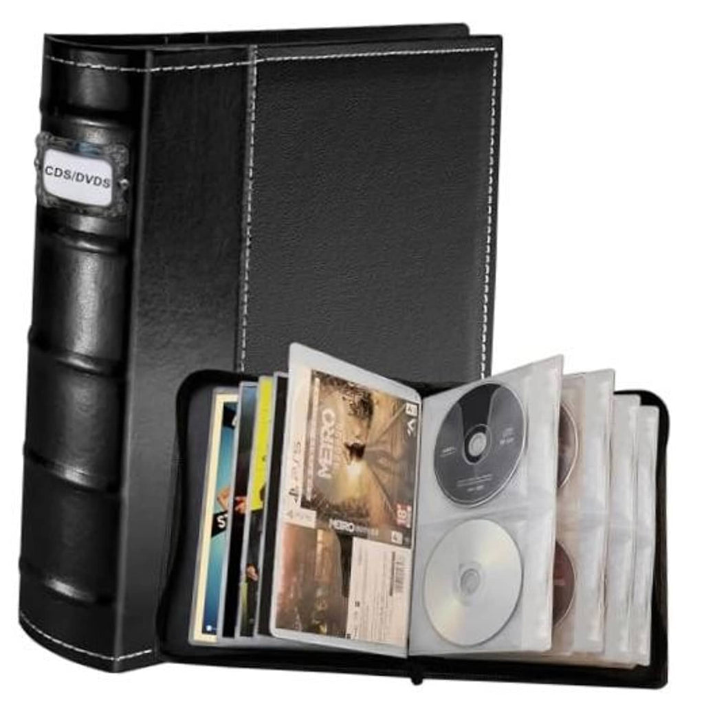 Black CD/DVD storage binder open with disc sleeves and booklet pockets, holding multiple CDs