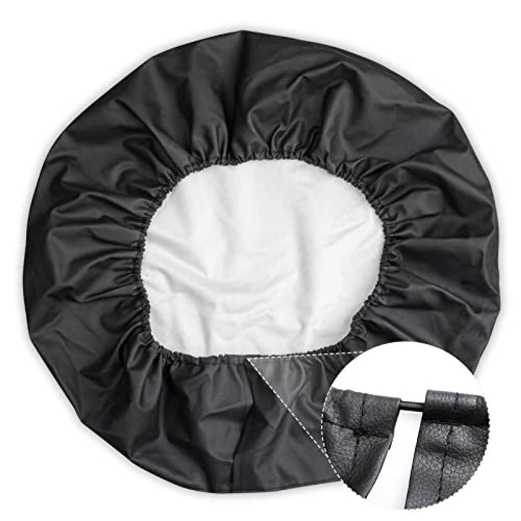 Black spare tire cover with elastic opening and reinforced strap detail, round shape