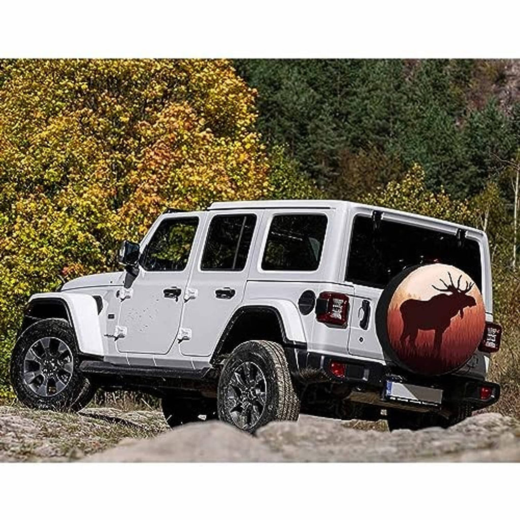 Moose spare tire cover on a white SUV, showing round moose sunset design