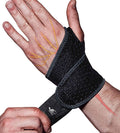 Black fabric wrist compression strap with hook-and-loop closure, single band