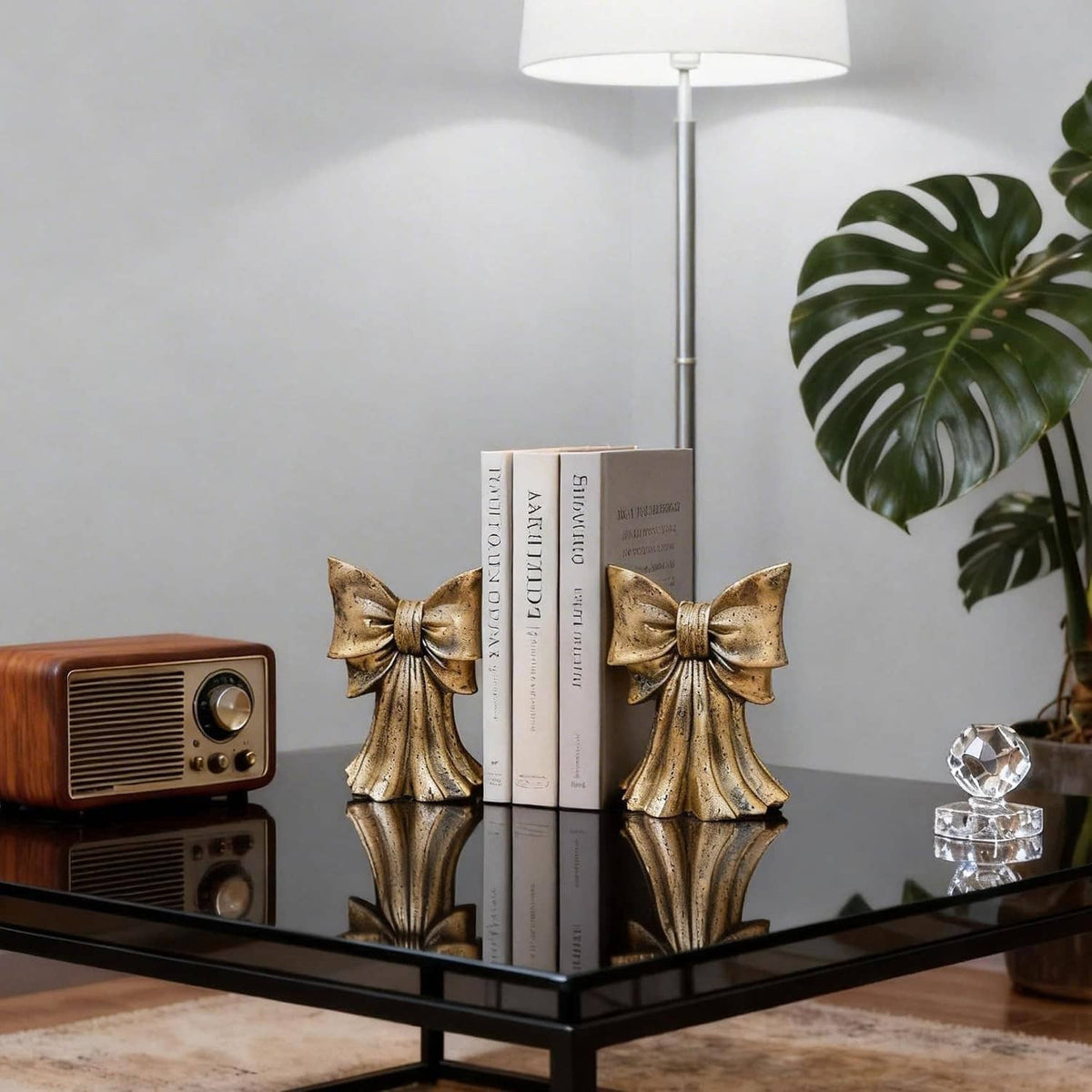 Pair of gold bow bookends with textured metal ribbon bows for upright support