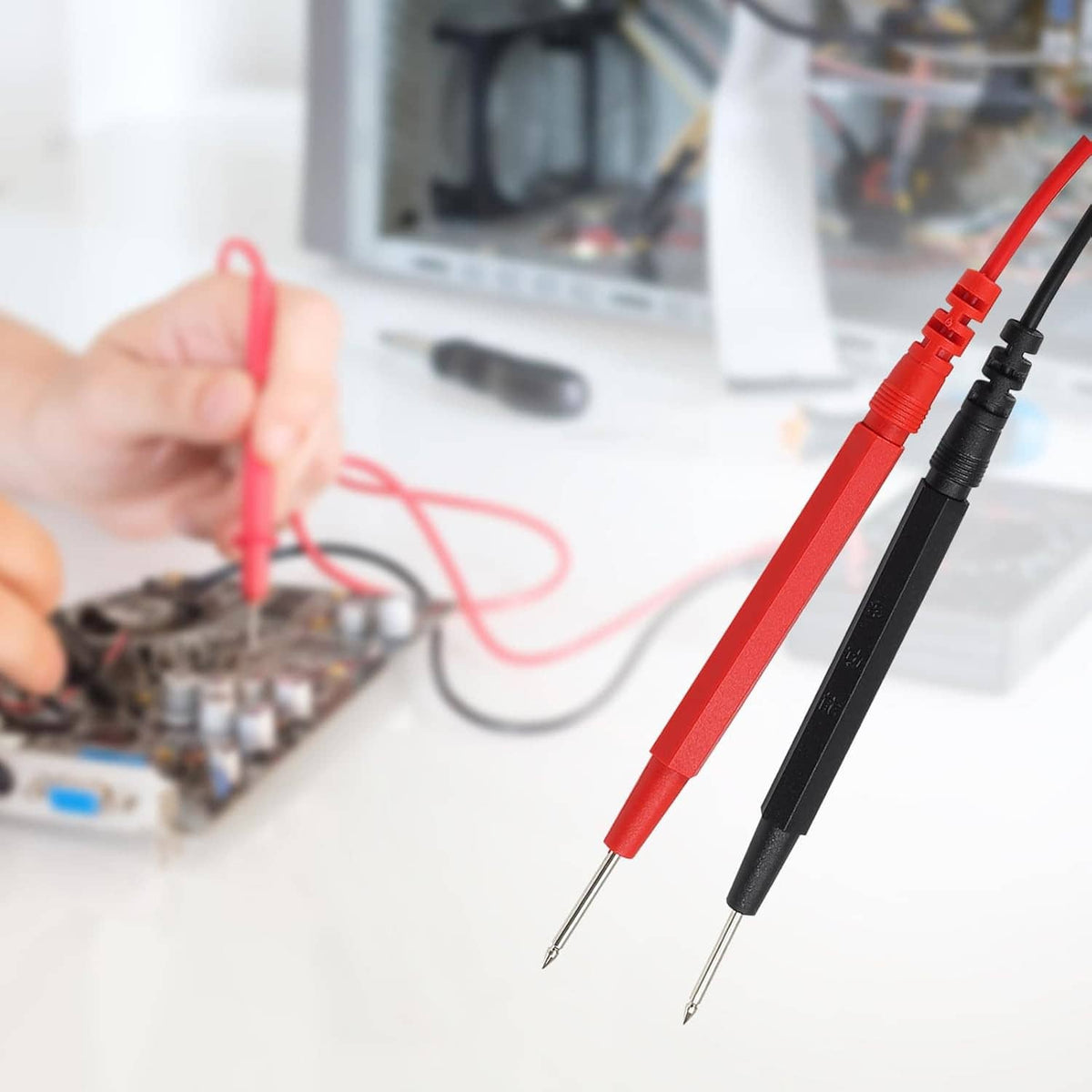 Close-up of red and black multimeter probes with insulated lead wires