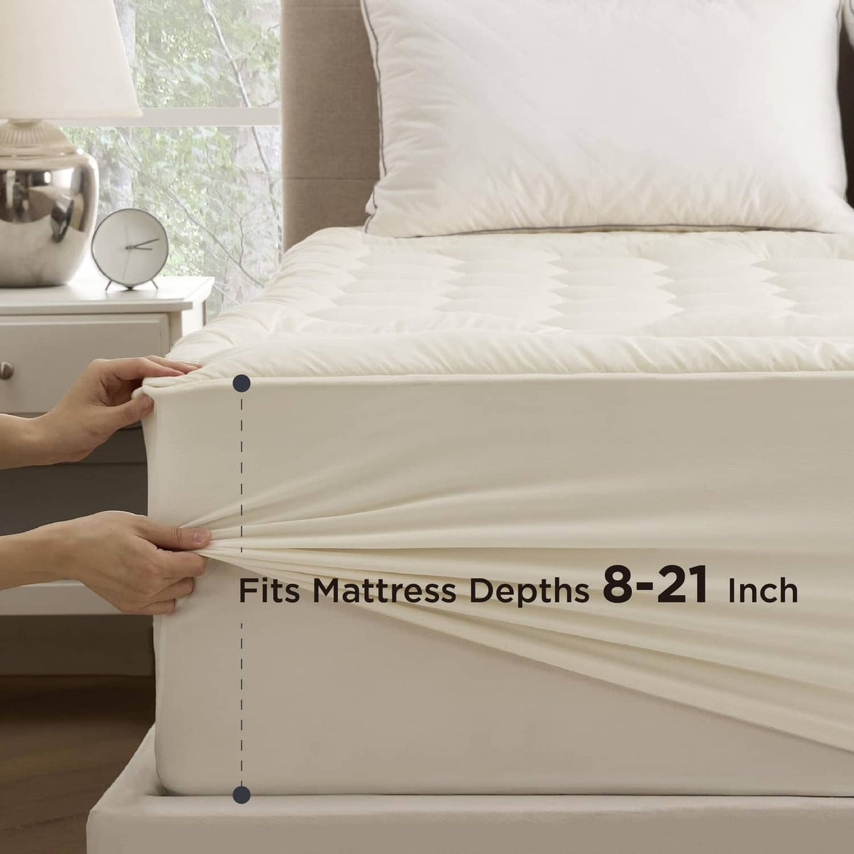 Fitted mattress pad skirt along the mattress edge, light beige